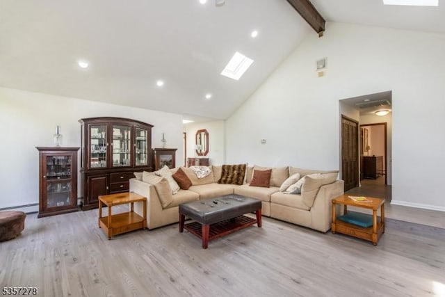 8 Reger Rd, Chester Twp, NJ 07836 - living room with high vaulted ceiling, beamed ceiling, light wood-type flooring, a skylight, and a baseboard heating unit
