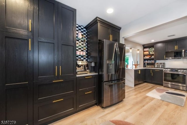 kitchen with stainless steel appliances, light wood-style floors, open shelves, light countertops, and recessed lighting