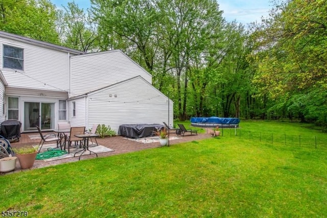 view of yard featuring a patio area and a covered pool