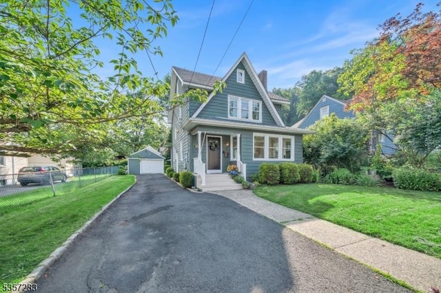 188 Watchung Ter, Scotch Plains Twp, NJ 07076 - view of front of home featuring a detached garage, an outdoor structure, driveway, and a chimney