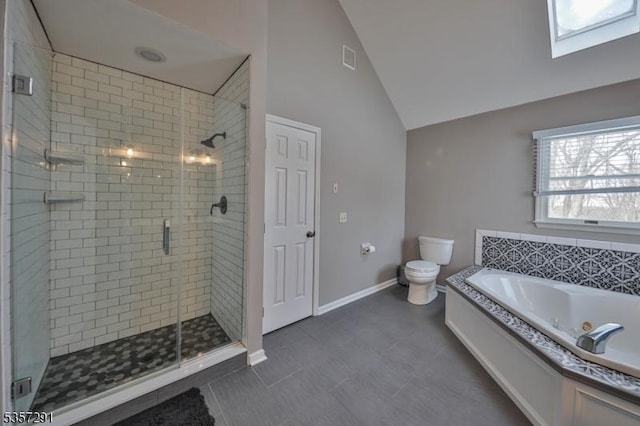 full bath with a jetted tub, lofted ceiling, a stall shower, toilet, and baseboards