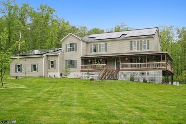 902 Sprout Hill Rd, Hampton Twp, NJ 07860 - back of house featuring solar panels, a lawn, and covered porch