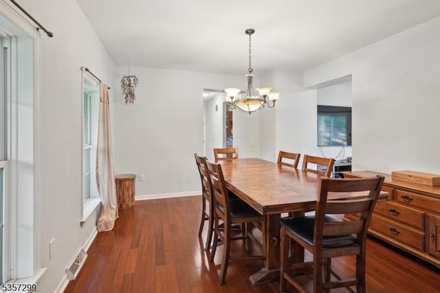 902 Sprout Hill Rd, Hampton Twp, NJ 07860 - dining area with a chandelier, dark wood-type flooring, and baseboards