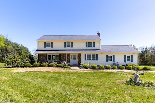 1602 Harbourton Rocktown Rd, Hopewell Twp, NJ 08530 - traditional home featuring a chimney, covered porch, a front lawn, and central AC