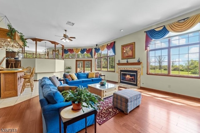 1602 Harbourton Rocktown Rd, Hopewell Twp, NJ 08530 - living area featuring a ceiling fan, wood finished floors, a fireplace with flush hearth, and baseboards