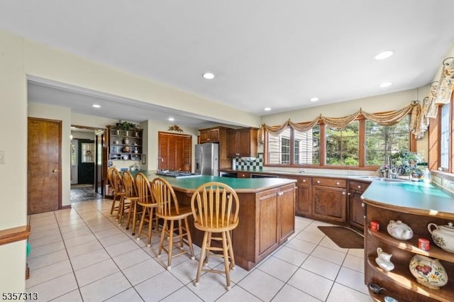 1602 Harbourton Rocktown Rd, Hopewell Twp, NJ 08530 - kitchen featuring stainless steel fridge, a kitchen breakfast bar, light tile patterned floors, recessed lighting, and open shelves