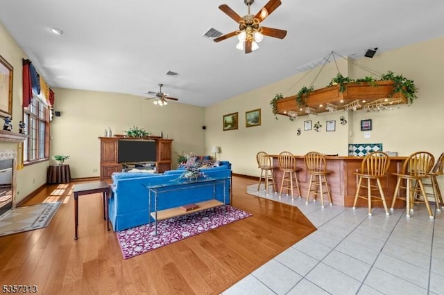 1602 Harbourton Rocktown Rd, Hopewell Twp, NJ 08530 - living area featuring a ceiling fan, a bar, baseboards, and wood finished floors