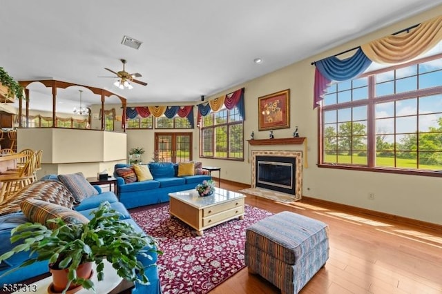 1602 Harbourton Rocktown Rd, Hopewell Twp, NJ 08530 - living room featuring wood finished floors, a ceiling fan, a fireplace with flush hearth, and baseboards