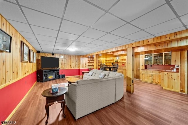 1602 Harbourton Rocktown Rd, Hopewell Twp, NJ 08530 - living area with wood walls, wood finished floors, a drop ceiling, and baseboards
