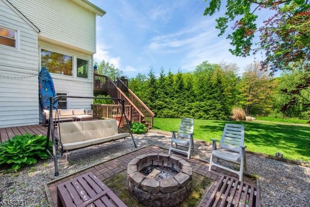 view of patio / terrace featuring stairway, an outdoor living space with a fire pit, and a wooden deck