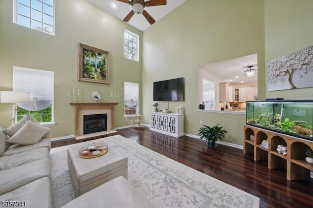 living room featuring high vaulted ceiling, ceiling fan, wood finished floors, plenty of natural light, and recessed lighting