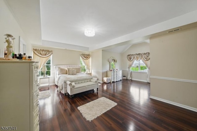 bedroom featuring baseboards and wood finished floors
