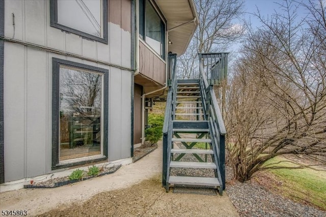 view of exterior entry featuring board and batten siding