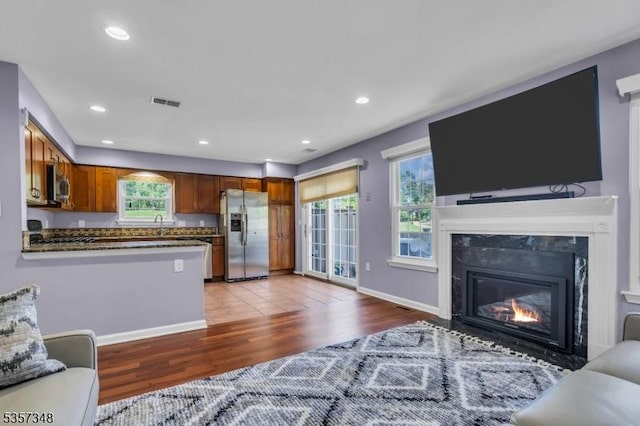 1901 Stech Dr, Bridgewater Twp, NJ 08807 - living area with light wood finished floors, recessed lighting, a premium fireplace, and baseboards