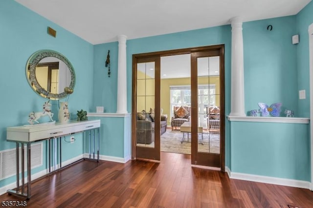 1901 Stech Dr, Bridgewater Twp, NJ 08807 - doorway to outside featuring decorative columns, wood finished floors, and baseboards