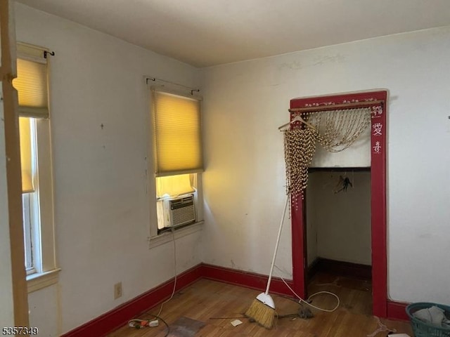 944 Madison Ave, Elizabeth City, NJ 07201 - unfurnished bedroom with cooling unit, wood finished floors, and baseboards