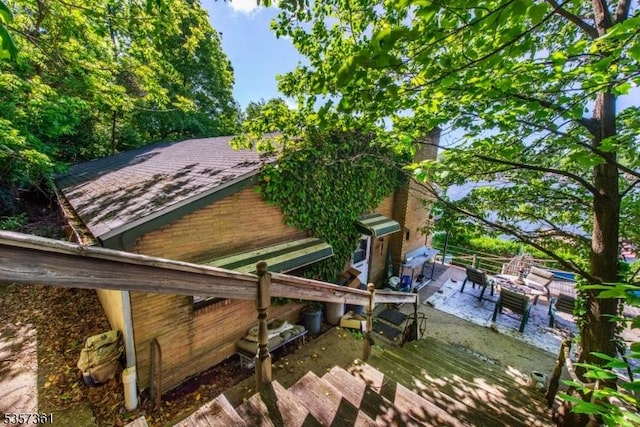 31 Cove Rd, Jefferson Twp, NJ 07849 - exterior space with a shingled roof and a chimney