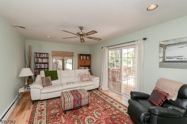 23 Horizon Dr, Roxbury Twp, NJ 07876 - living room featuring a baseboard heating unit, healthy amount of natural light, a ceiling fan, wood finished floors, and recessed lighting