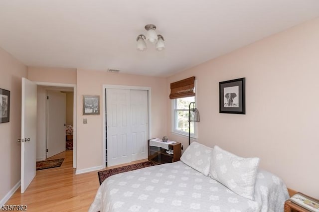 23 Horizon Dr, Roxbury Twp, NJ 07876 - bedroom featuring light wood-style floors, a closet, and baseboards