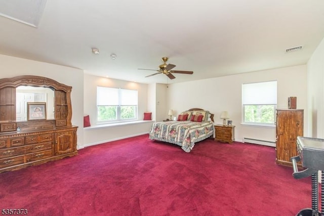 bedroom with a baseboard heating unit, carpet, ceiling fan, and baseboards