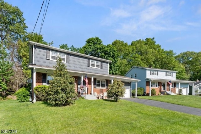 39 Circle Dr, Rockaway Twp, NJ 07866 - view of front facade featuring a porch, brick siding, an attached garage, and asphalt driveway