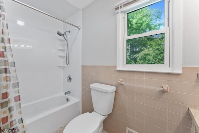 39 Circle Dr, Rockaway Twp, NJ 07866 - bathroom with tile walls, toilet, wainscoting, and shower / bath combo with shower curtain