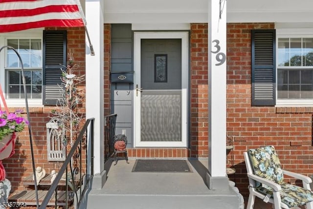 39 Circle Dr, Rockaway Twp, NJ 07866 - doorway to property with brick siding and a porch