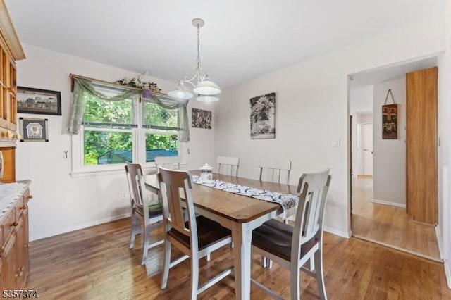 39 Circle Dr, Rockaway Twp, NJ 07866 - dining space featuring light wood finished floors, baseboards, and a chandelier