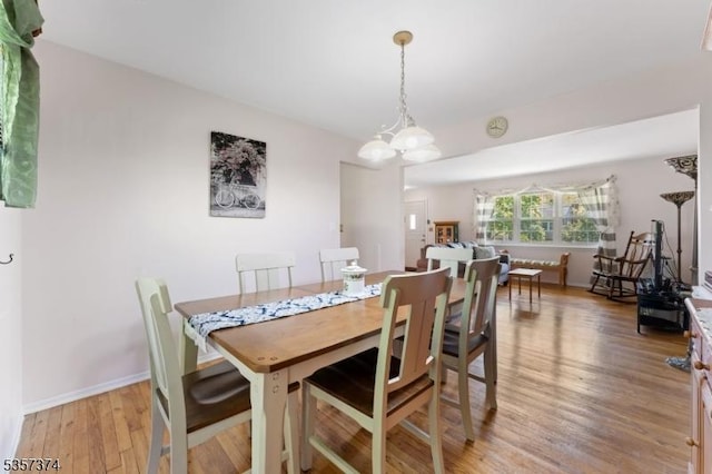 39 Circle Dr, Rockaway Twp, NJ 07866 - dining area with light wood finished floors, baseboards, and a chandelier