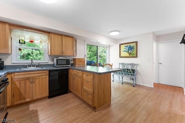39 Circle Dr, Rockaway Twp, NJ 07866 - kitchen featuring dishwasher, a sink, stainless steel microwave, a peninsula, and light wood finished floors
