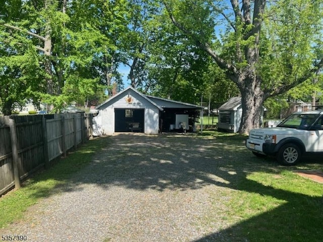 detached garage featuring driveway