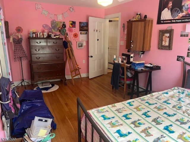 bedroom featuring wood finished floors
