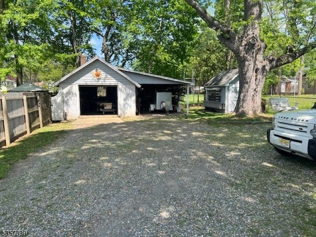 garage with a garage and fence
