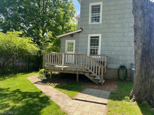 back of property with a wooden deck