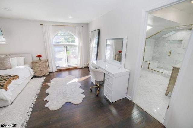 bedroom with dark wood-type flooring, a desk, recessed lighting, and ensuite bath