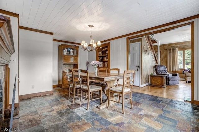 2 Troll Ln, Rockaway Twp, NJ 07866 - dining room featuring stone finish floors, a chandelier, baseboards, crown molding, and wood ceiling