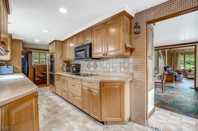 2 Troll Ln, Rockaway Twp, NJ 07866 - kitchen featuring a sink, black appliances, light countertops, backsplash, and light stone finish flooring