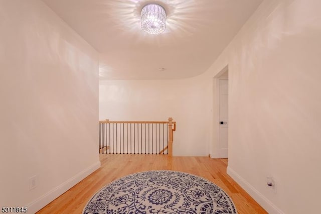 24 Covered Bridge Rd, Branchburg Twp, NJ 08853 - corridor featuring an upstairs landing, wood finished floors, and baseboards