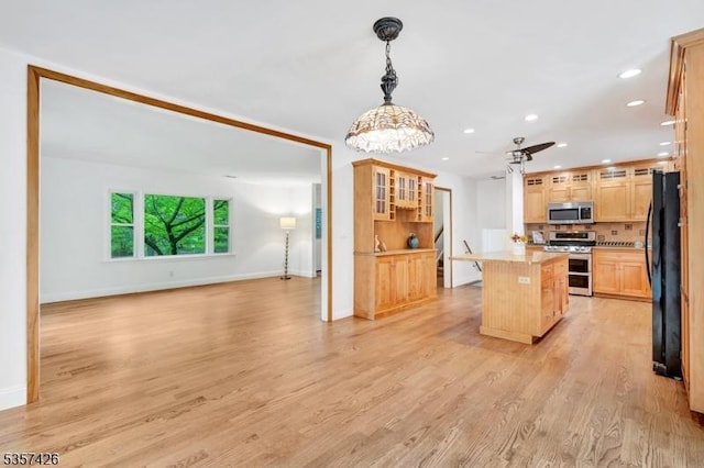 10 Hunts Mill Rd, Clinton Town, NJ 08809 - kitchen with appliances with stainless steel finishes, recessed lighting, light brown cabinetry, baseboards, and a center island