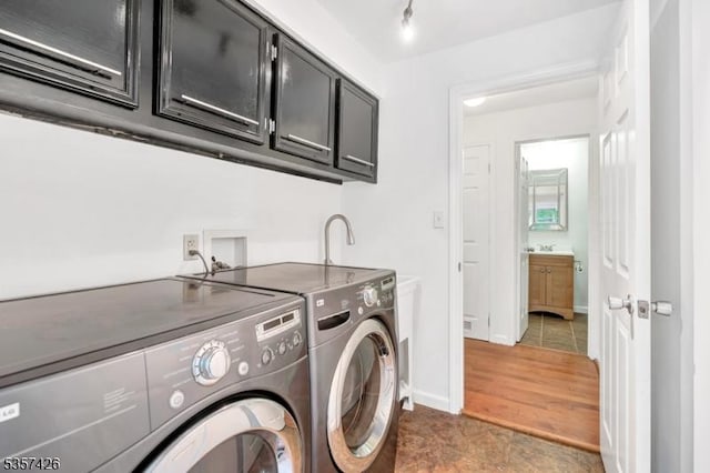 10 Hunts Mill Rd, Clinton Town, NJ 08809 - laundry room with cabinet space, washing machine and dryer, tile patterned flooring, and baseboards