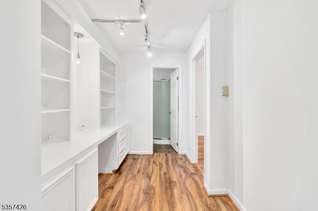 10 Hunts Mill Rd, Clinton Town, NJ 08809 - corridor featuring light wood-type flooring, an office area, baseboards, and built in features