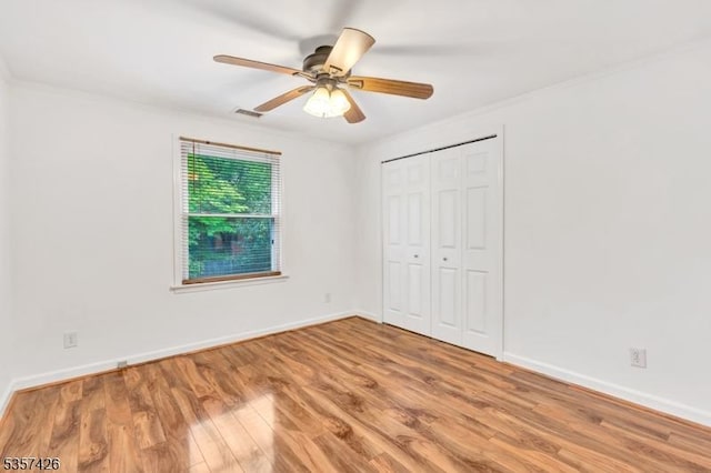 10 Hunts Mill Rd, Clinton Town, NJ 08809 - unfurnished bedroom featuring wood finished floors, baseboards, a closet, and ornamental molding