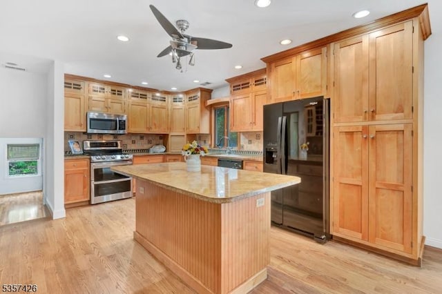 10 Hunts Mill Rd, Clinton Town, NJ 08809 - kitchen with black appliances, light wood finished floors, a ceiling fan, a kitchen island, and recessed lighting