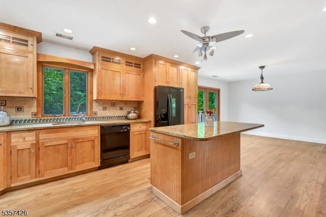 10 Hunts Mill Rd, Clinton Town, NJ 08809 - kitchen with black appliances, tasteful backsplash, a kitchen island, a ceiling fan, and light wood-style floors