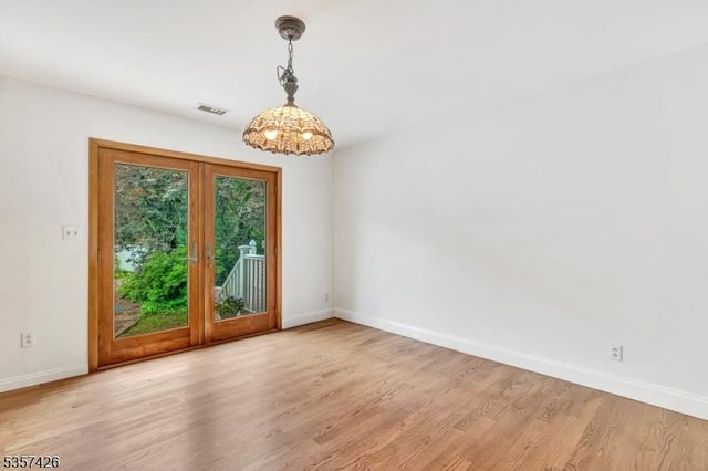 10 Hunts Mill Rd, Clinton Town, NJ 08809 - empty room with baseboards, light wood-style flooring, and a chandelier