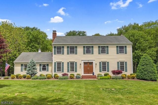 19 Bennington Dr, Mount Olive Twp, NJ 07836 - colonial-style house with a chimney and a front lawn