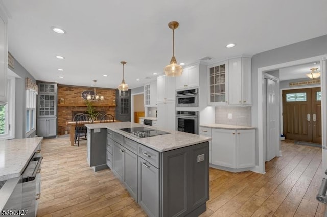 19 Bennington Dr, Mount Olive Twp, NJ 07836 - kitchen featuring black electric cooktop, white cabinets, gray cabinetry, double oven, and light wood finished floors