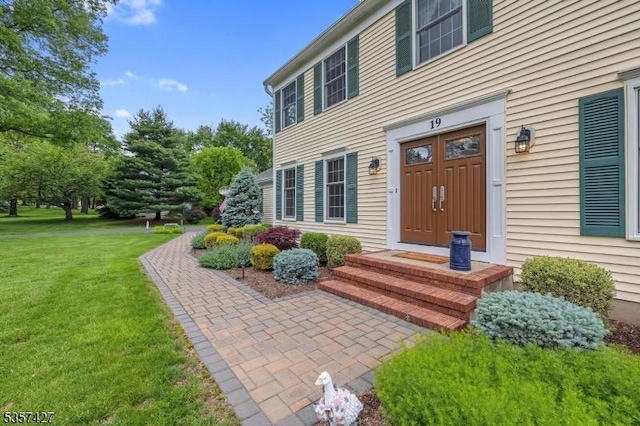 19 Bennington Dr, Mount Olive Twp, NJ 07836 - doorway to property with a yard