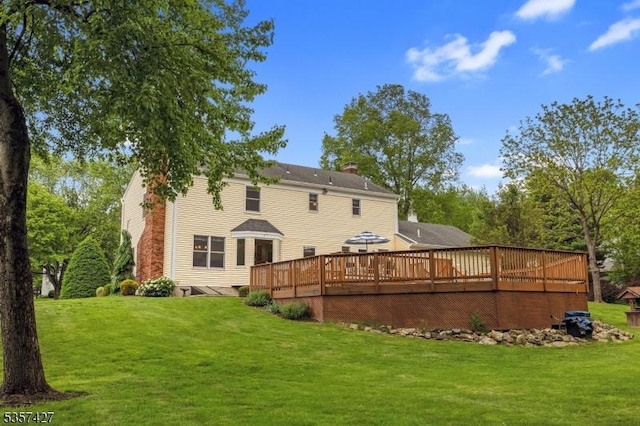 19 Bennington Dr, Mount Olive Twp, NJ 07836 - back of house with a wooden deck, a yard, and a chimney