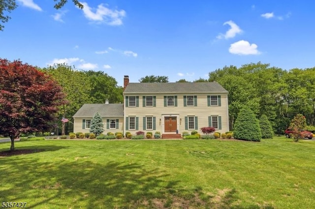 19 Bennington Dr, Mount Olive Twp, NJ 07836 - colonial-style house with a chimney and a front lawn